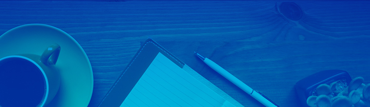 Aerial view of desktop - Pictured left to right: coffee cup, notebook, succulent; with blue overlay over entire image.